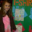 Mara Abbott, daughter of Jason and Alexa Abbott of Westport Island, is all smiles as she is recognized for creating the best T-shirt design in the Focus on Agriculture in Rural Maine Schools’ contest. Courtesy of Alexa Abbott