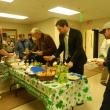 Guests line up along the buffet table to enjoy some traditional Irish food. CHARLOTTE BOYNTON/Wiscasset Newspaper