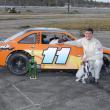 Woolwich's Adam Chadbourn waves the checkered flag for his win in the 25-Super Stock division. Courtesy of Peter Taylor