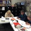 Woolwich selectmen sign the 2013 town meeting warrant on April 22. JOHN MAGUIRE/Wiscasset Newspaper