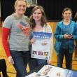 Julia Clukey takes time to sign posters and pose for a photo with Kasey Cromwell after her motivational speech to Wiscasset High School students on April 5. KATHY ONORATO/Wiscasset Newspaper