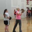 Coach Claire Daniels, right, gives some throwing tips to Charlene Reed at a recent practice at Wiscasset High School. KATHY ONORATO/Wiscasset Newspaper