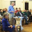 Wright committee member Richard DeVries presented a signed petition asking the town to hold the Wright property “in perpetuity” for public use. In the foreground is Ann Dowrick, who currently lives in the Wright house and pays rent to the town. JOHN MAGUIRE/Wiscasset Newspaper