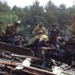 Dresden and Richmond firefighters sort through debris June 30 following a rekindle of the fire that destroyed this Cedar Grove Road, Dresden, home a day earlier. SUSAN JOHNS/Wiscasset Newspaper