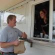 First-time customer Wayne Eugley of South Bristol picks up his order from Sea Digger's Grub co-owner Sydney Morin. SUSAN JOHNS/Wiscasset Newspaper