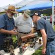 New England Model Engineering Society members Dick Boucher and Ron Ginger explain the inner workings of a scale model device. SUE MELLO/Boothbay Register