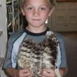  Austin holds an owl wing during the “Dig Into Reading” program on July 12. Courtesy of the Wiscasset Public Library