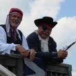 Alan Boyes, left, of Boothbay and Don Davis of Wiscasset watch July 4 festivities from the Wiscasset Yacht Club deck. SUSAN JOHNS/Wiscasset Newspaper