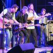 THE BODEANS rocks a packed Opera House this past Friday night. Kurt Neumann, founder and frontman, is the second from the left.     GARY DOW/Boothbay Register