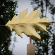 “Red Oak Leaf,” sculpted in mahogany, gold leaf, copper and cedar by John Bowdren, is part of the “Living Wood” exhibit at Coastal Maine Botanical Gardens. Curator June LaCombe will offer a walking tour on September 12. Courtesy of Frances Buerkens