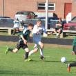 CAMDEN REISS, center, fights his way through Spruce Mountain’s defense in this October 8 file photo. Reiss and the Wolverines will look to continue their winning ways October 18 against Oak Hill. BEN BULKELEY/Wiscasset Newspaper