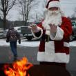 Santa warms his gloved hands at a 2012 holiday event. Courtesy of Wiscasset Area Chamber of Commerce