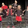Front row: Cora Tindal, Oscar Mirabile, Josie Roy, Jackie Cronk; back row: Finley Piercy, and Kaylee Wayda perform in "We Are Santa's Elves".  