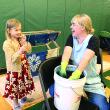 Indigo Sanders-Stoyle, 7, of Wiscasset watches artist Emily Bell-Hoerth dip and dye in indigo at Wiscasset’s Earth Day celebration at Wiscasset Community Center April 27. SUSAN JOHNS/Wiscasset Newspaper 