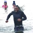 One of the participants in the Penguin Plunge can't leave the water fast enough. KEVIN BURNHAM/Boothbay Register