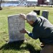 Steve Christiansen examines the headstone of Ezekiel Averill remembered for having served as a body guard to George Washington during the American Revolution. PHIL DI VECE/Wiscasset Newspaper