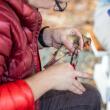 For more than 100 years, thousands of people have been affixing simple bands to the legs of birds in order to understand more about bird movements and answer other questions about their biology. Here, a bird bander is banding a northern cardinal. (Photo USGS)