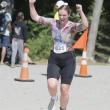 A triathlete celebrates completing the 2025 Pemaquid Beach Triathlon. Photo by Bob Kofman
