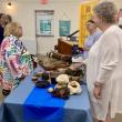 Guests peruse a typical travel pack of a Continental soldier. ISABELLE CURTIS/Boothbay Register
