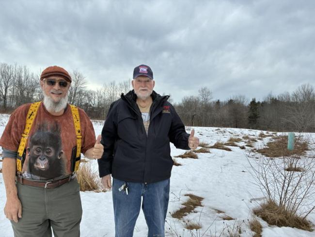 On this parcel on Wiscasset’s Route 27, prospective land donor Allen “Big Al” Cohen, left, and Boothbay V.E.T.S. founder Ed Harmon show their enthusiasm March 8 for the project   eyed to help veterans. SUSAN JOHNS/Wiscasset Newspaper