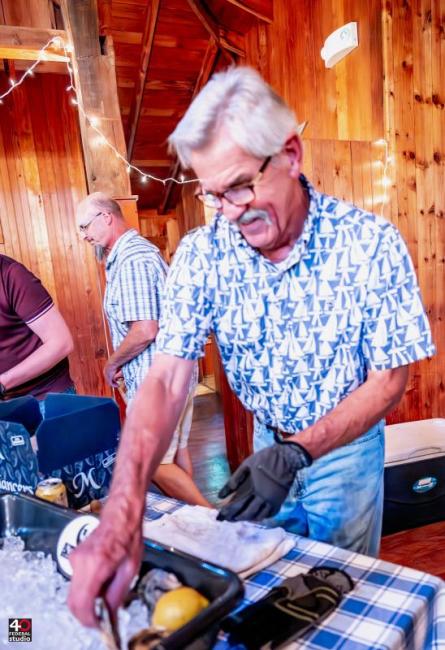 Skyler Wentworth opening oysters. Courtesy of Lynn Maloney