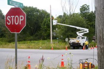 Crews repair damaged lines at the intersection of Route 1 and Nequasset Road. JOHN MAGUIRE/Wiscasset Newspaper