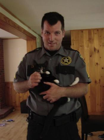 Kyle Canada holds kitten that visited Two Bridges Jail on Aug. 2