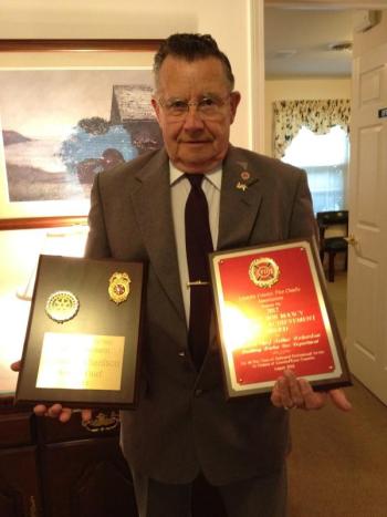 Arthur Richardson holds the Bob Maxcy Lifetime Achievement Award and a plaque he received from the Boothbay Harbor Rotary Club in 2004 for his years of service to the Boothbay Harbor Fire Department.