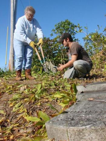 Gail McKinney, left, of Skowhegan and Mike Miete of Dresden help clean up around old grave stones. SUSAN JOHNS/Wiscasset Newspaper Gail McKinney, left, of Skowhegan and Mike Miete of Dresden help clean up around old grave stones. SUSAN JOHNS/Wiscasset Newspaper