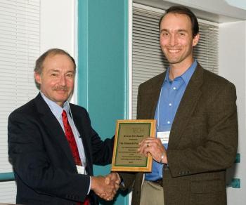 University of Maine School of Law professor Jeffrey Thaler presents the E2 Can Do! award to Chewonki’s president Willard Morgan at a dinner in Portland. Courtesy of Chewonki 