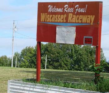 A couple of months ago, an auction announcement stood next to this sign. Now, the grass is freshly cut and the track's new owners are less than two months away from a planned race. SUSAN JOHNS/Wiscasset Newspaper
