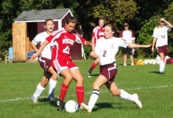 Midfielder Miranda McIntire tries to move the ball against Monmouth defenders on Wednesday. Kathy Onorato/Wiscasset Newspaper 