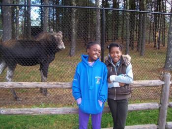 Rose Julie Reby, right, of Haiti, visits the Maine Wildlife Park in Gray during her stay with Nancy and Andy Call of Dresden.