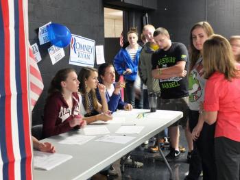 Student Council members, seated left to right, Megan Corson, Sarah Hanley and Zach Ellison, check in student voters at Wiscasset High School’s mock election on October 30. Below: Annalise Haase and Nick Brackley cast their ballots. Ballot Clerks are Maddly Wehrle and Ryan Hanley. KATHY ONORATO/Wiscasset Newspaper