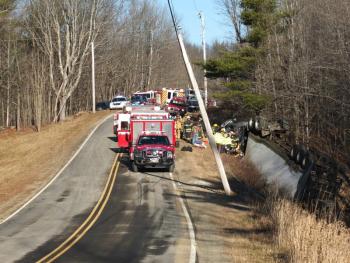 The driver of this tractor trailer is reportedly in critical condition at Maine Medical Center. Firefighters and emergency service personnel from Dresden, Richmond, Wiscasset and surrounding towns responded to the scene of the accident on the Middle Road in Dresden Christmas Eve. JOHN MAGUIRE/Wiscasset Newspaper