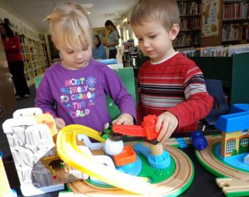 Grace Segerstrom and J. J. Pray enjoy the train and tracks set donated to the Wiscasset Public Library Children’s Room by Papa Geppetto’s Workshop. Courtesy of Wiscasset Public Library Grace Segerstrom and J. J. Pray enjoy the train and tracks set donated to the Wiscasset Public Library Children’s Room by Papa Geppetto’s Workshop. Courtesy of Wiscasset Public Library