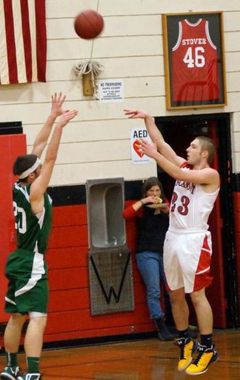 Austin Haskell launches a shot up over a Carrabec defender.