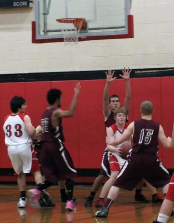 Matt Craig tries to make a move against Monmouth defenders. Matt Craig tries to make a move against Monmouth defenders.