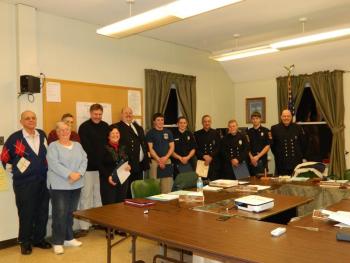 Members of the Wiscasset Fire Department, from left: Selectmen Edward Polewarczyk, Judy Colby, William Curtis, Jefferson Slack, and Pam Dunning, Fire Chief Rob Bickford, Spencer Bailey, Nick Grover, Bob Meisine, Sam Schmal, Steven Smith, and Tim Weatherbee. CHARLOTTE BOYNTON/Wiscasset Newspaper