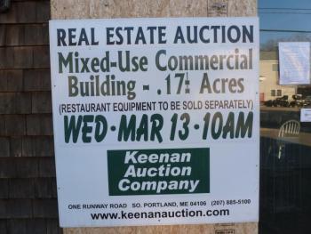 A large sign on the front of 93 Townsend Ave proclaims the date of the auction. KATRINA CLARK/Boothbay Register