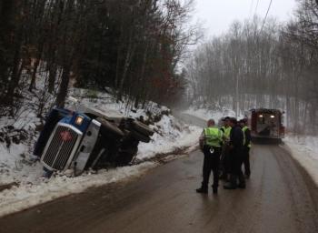 A Dead River Company fuel truck was in a ditch this morning in Alna as a tow truck driver worked to upright it. SUSAN JOHNS/Wiscasset Newspaper