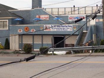 An excavator brought down these wires on Eddy Road in Edgecomb October 19, 2012. The charge a man faced in the incident was dropped January 24 in Wiscasset District Court. KATHY ONORATO/Wiscasset Newspaper