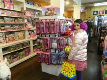 Eva Tebbutt checks out the Barbie display at Papa Geppetto's. Below: Owners Julie and Geoff Groleau welcome their guests to their open house February 16, attended by several Wiscasset elected officials. CHARLOTTE BOYNTON/Wiscasset Newspaper Eva Tebbutt checks out the Barbie display at Papa Geppetto's. CHARLOTTE BOYNTON/Wiscasset Newspaper
