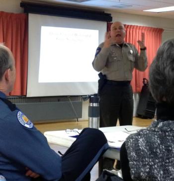 Lincoln County Sheriff's Deputy Mark Bridgham gives an animated portrayal of someone under the influence of drugs. SUSAN JOHNS/Wiscasset Newspaper