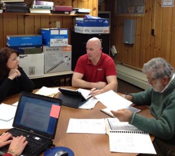 Edgecomb Selectmen Jessica Chubbuck, left, Stuart Smith and Jack Sarmanian discuss Chubbuck's proposal for 1 percent pay hikes. SUSAN JOHNS/Wiscasset Newspaper