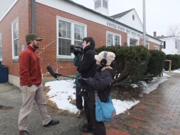 The NHK Television crew from Japan interviews Shawn Griffith of Boothbay in front of the Wiscasset Post Office March 1. JOHN MAGUIRE/Wiscasset Newspaper