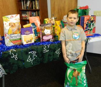 Woolwich central School Kindergartner Stone Medina, stands by his birthday presents at the Wiscasset Community Center this past Sunday. He requested that his friends bring cat and dog food, instead of presents for himself. He donated his gifts to the Lincoln County Animal Shelter. CHARLOTTE BOYNTON/Wiscasset Newspaper Woolwich central School Kindergartner Stone Medina, stands by his birthday presents at the Wiscasset Community Center this past Sunday. He requested that his friends bring cat and dog food, instead of presents for himself. He donated his gifts to the Lincoln County Animal Shelter. CHARLOTTE BOYNTON/Wiscasset Newspaper