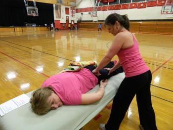 Tracey Verney enjoys a pre-workout massage from trainer Kristina Phillips during Week 2 of Lisa Hall’s Weight Loss Challenge. Below: Patti Jo Averill holds a plank position during a “punishment” workout March 11. KATHY ONORATO/Wiscasset Newspaper Tracey Verney enjoys a pre-workout massage from trainer Kristina Phillips during Week 2 of Lisa Hall’s Weight Loss Challenge. KATHY ONORATO/Wiscasset Newspaper