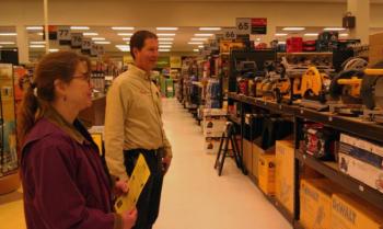 Ames Supply's Wayne Averill, right, gives WorkReady graduate Theresa Pottle, left, of Bristol, a tour of the store, while explaining what he looks for in potential employees. Courtesy of Wiscasset Adult and Community Education