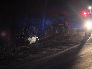 This Nissan Altima crossed Route 218 in Alna then stopped in the woods after its driver apparently missed the Rabbit Path Road stop sign. JOHN MAGUIRE/Wiscasset Newspaper